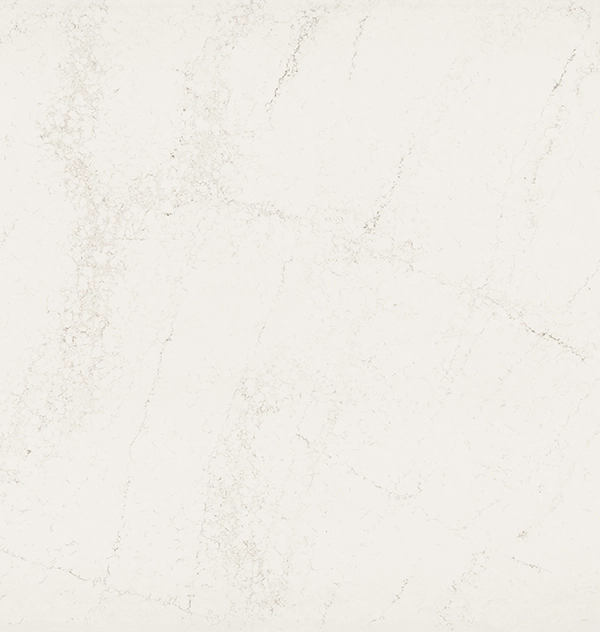 Smooth white marble surface with subtle grey veining and natural texture.
